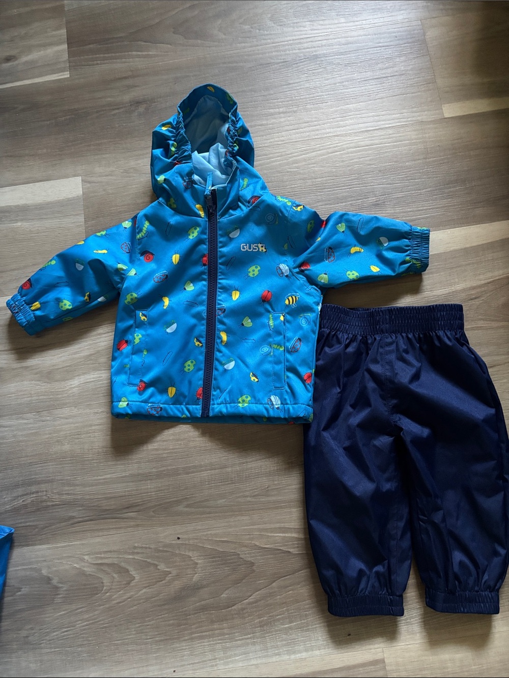 Gusti Bright Blue Kids Hooded Rain Jacket with Colorful Bugs